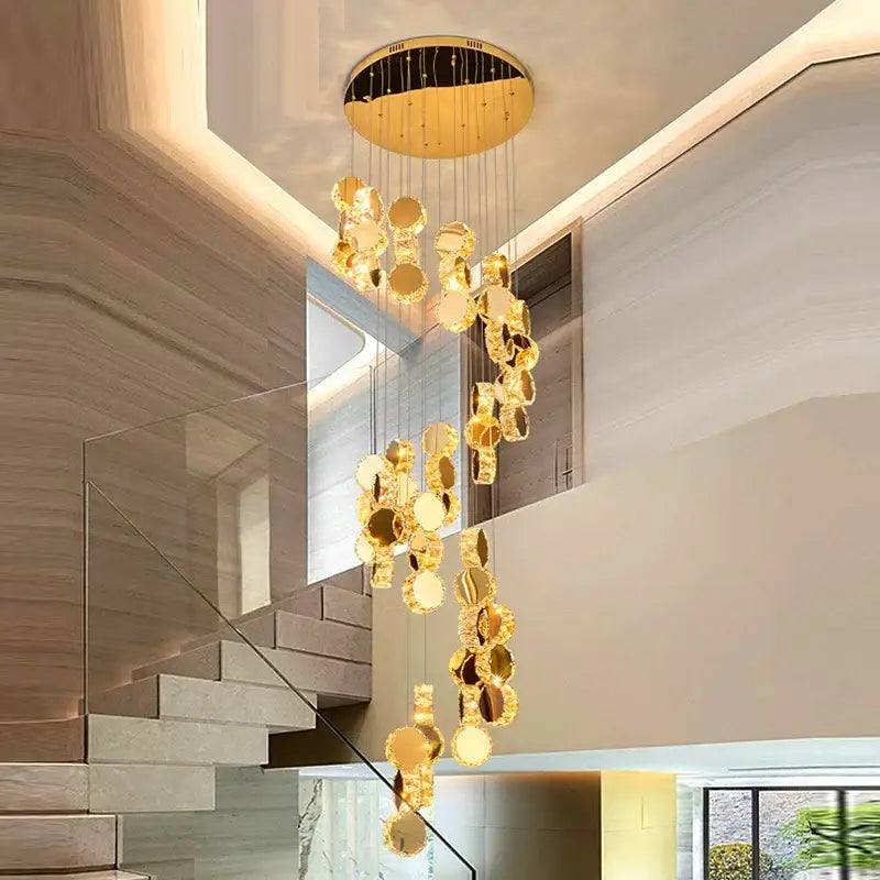 Golden circular decorbites crystal chandelier with mirrored discs suspended from modern ceiling fixture for stair pendant lighting