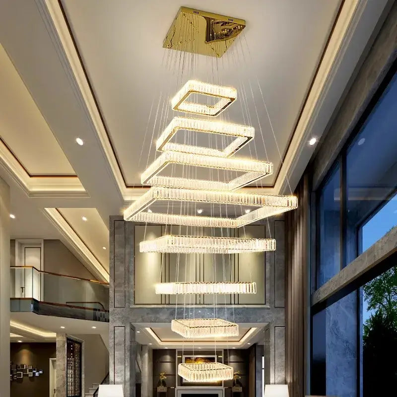 A decorbites crystal chandelier pendant lamp with cascading rectangular crystal tiers and gold finish for stairs