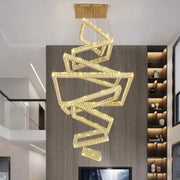 Golden crystal chandelier with modern geometric interlocking frames from DecorBites crystal chandelier stair pendant lamp