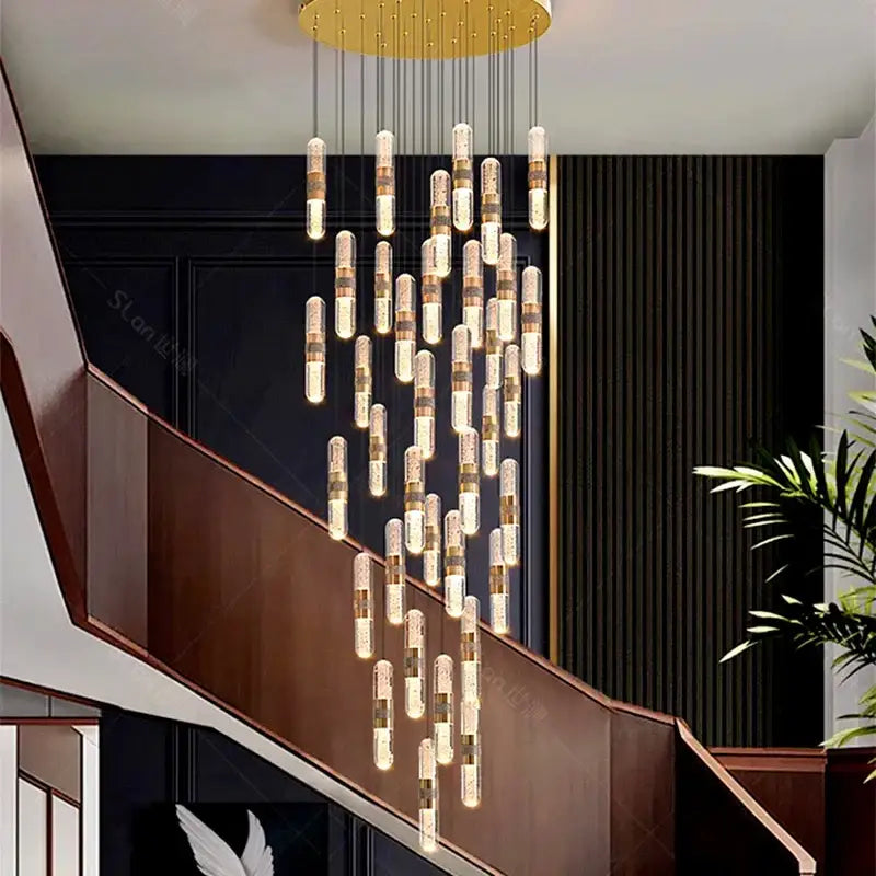 Modern DecorBites crystal chandelier pendant lamp with golden circular top and crystal-embedded glass cylinders for stair lighting