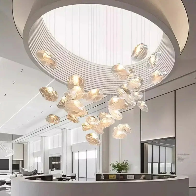 A modern DecorBites crystal chandelier stair pendant with translucent golden shells for living room lighting