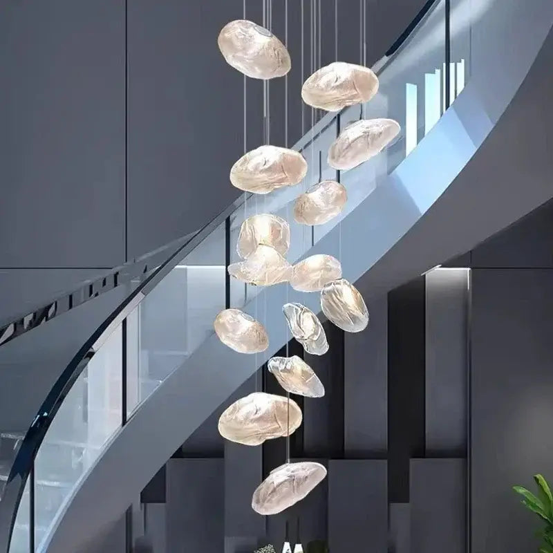 A modern DecorBites crystal chandelier stair pendant lamp with translucent glass orbs in a cascading design