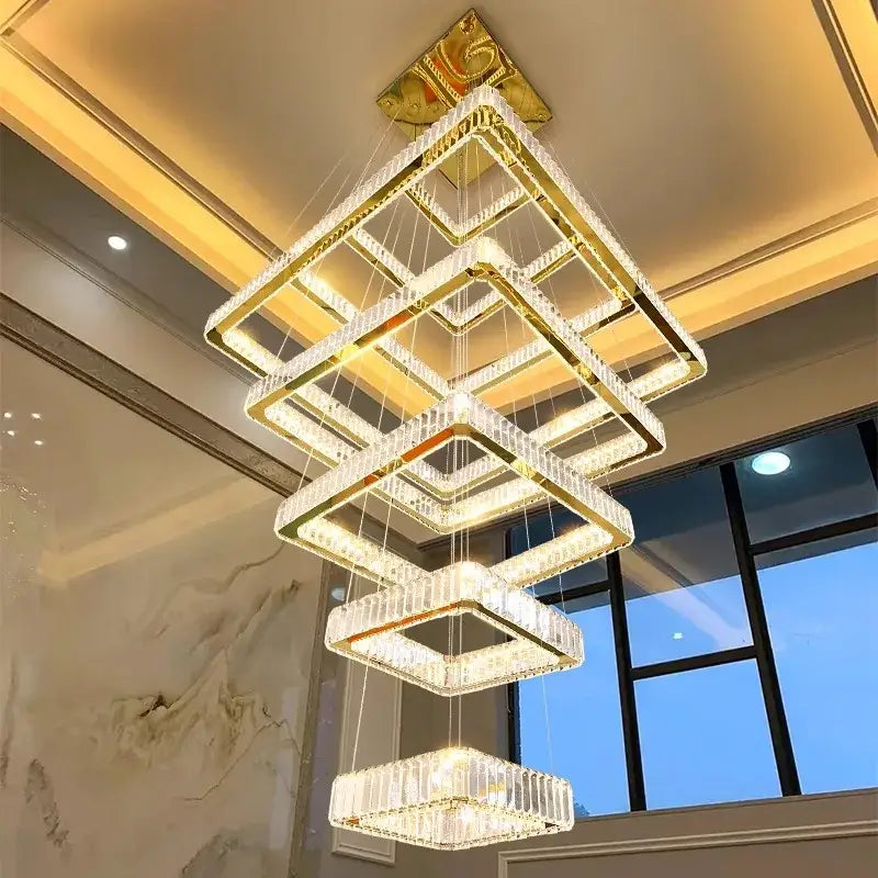 A modern decorbites crystal chandelier stair pendant light with gold-toned frames and cascading square tiers