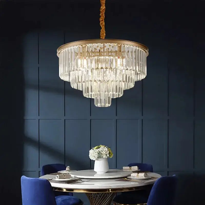 A decorbites crystal chandelier stair pendant light with gold-toned frame and cascading clear glass rods for modern decor