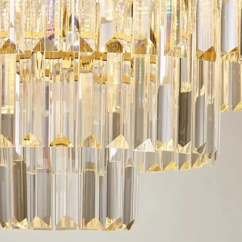 DecorBites crystal chandelier pendant light with gold-toned brass and faceted glass prisms for modern stair lighting