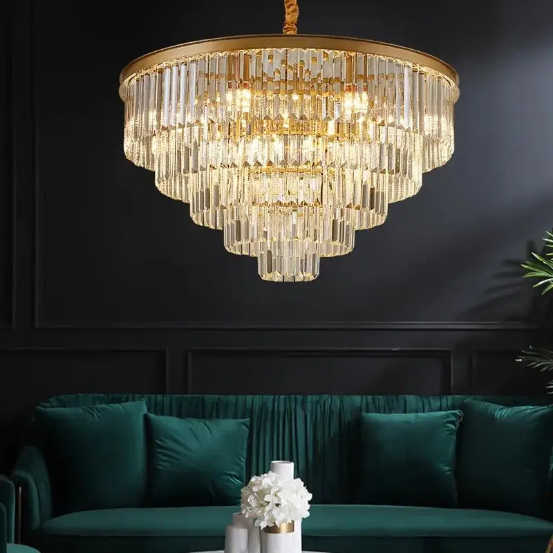 DecorBites crystal chandelier stair pendant light with gold frame and clear glass rods above green velvet sofa