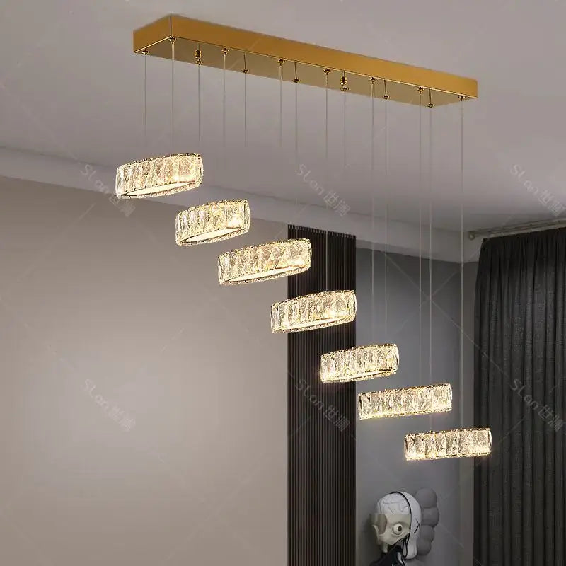 Gold rectangular decorbites crystal chandelier stair pendant light featuring seven cascading crystal rings for living room lighting