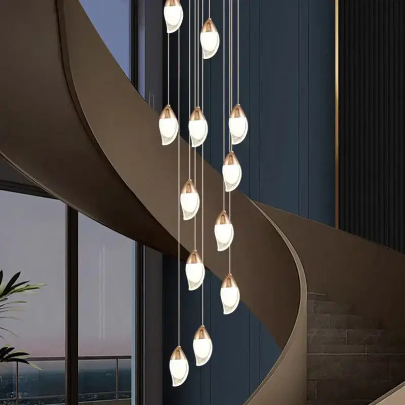 Modern pendant chandelier with teardrop glass shades and brushed gold accents for living room by decorbites crystal chandelier