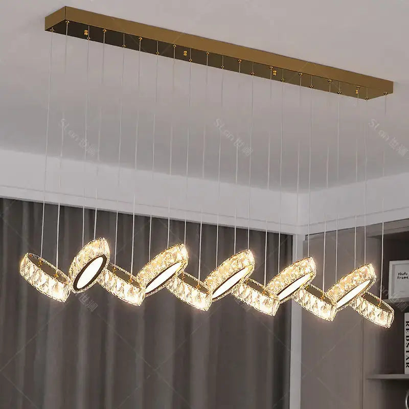 Gold-toned decorbites crystal chandelier with five interlocking crystal-encrusted circular lights for living room lighting
