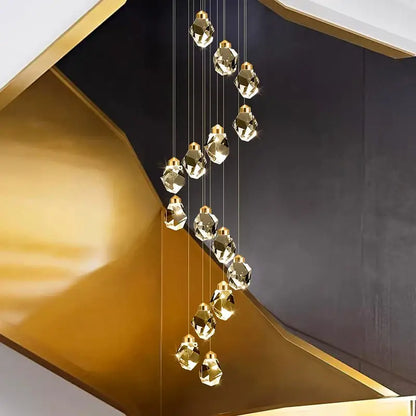 A modern gold-toned crystal chandelier pendant light with faceted geometric design by DecorBites for living rooms