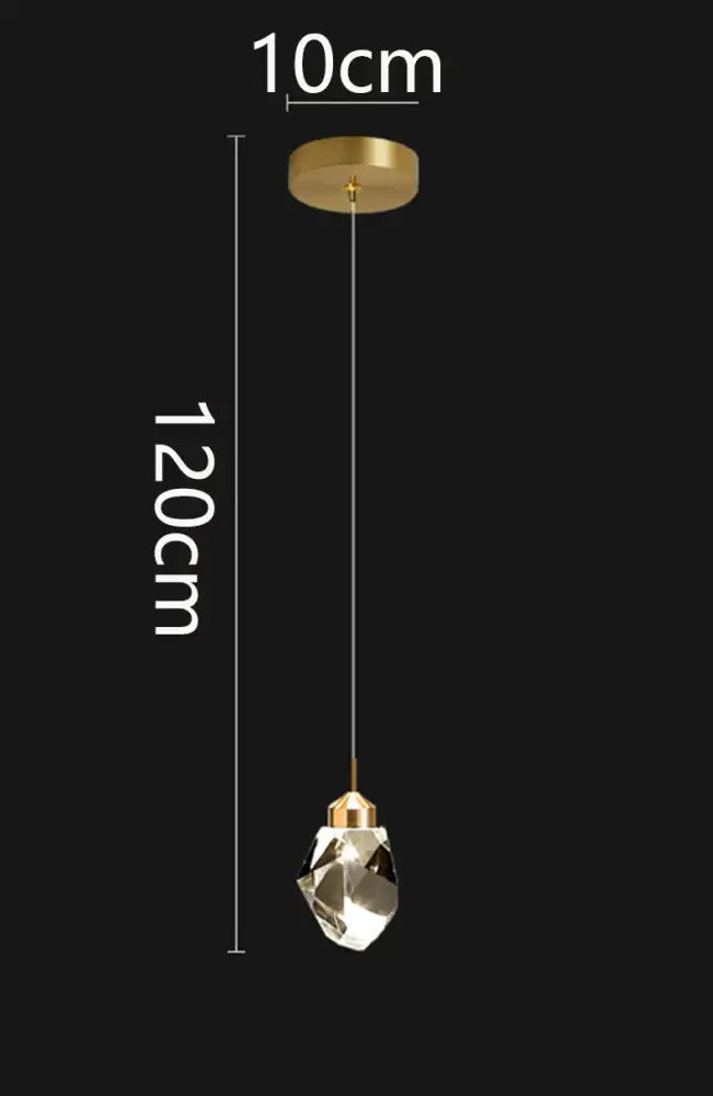 A sleek decorbites crystal chandelier pendant light with gold-toned mount and faceted crystal globe for modern interiors