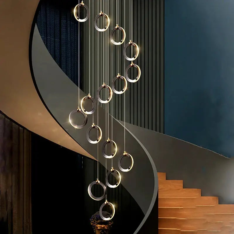 Modern minimalist decorbites crystal chandelier with polished metallic rings emitting warm ambient light for living room