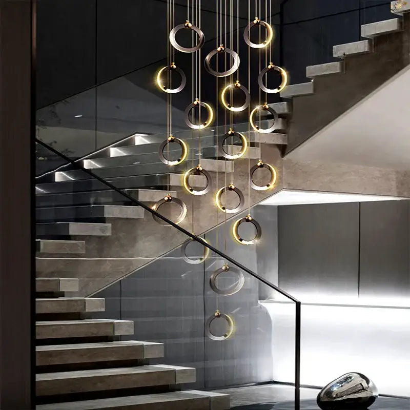 Modern decorbites crystal chandelier with circular rings in brushed gold and matte silver for living room lighting