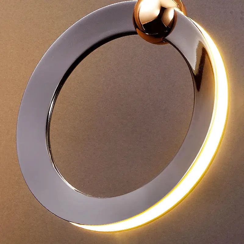 Decorbites crystal chandelier stair pendant featuring a sleek polished chrome circular light with warm yellow led glow