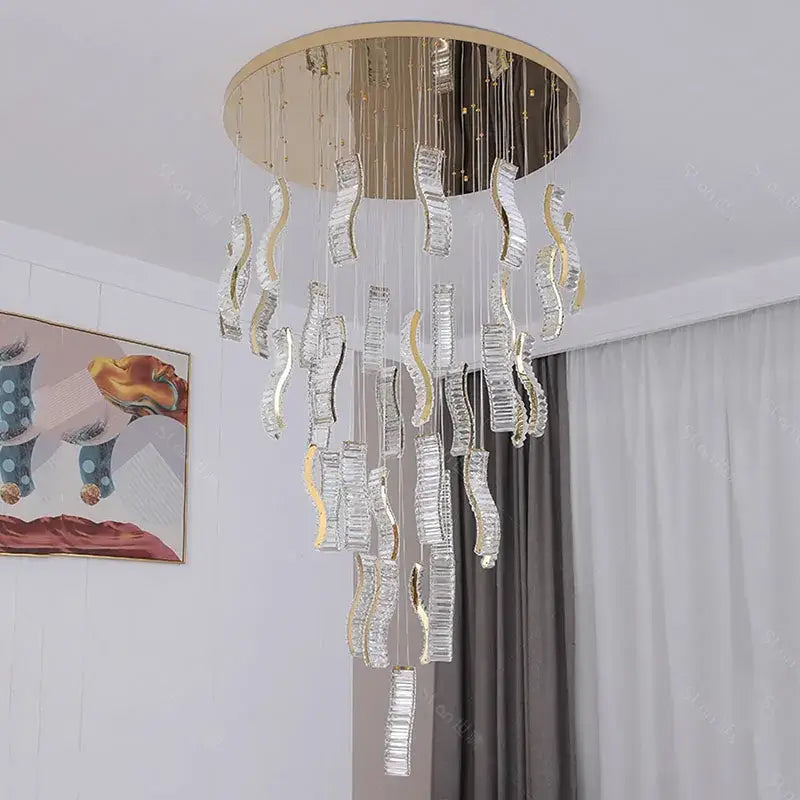 Elegant gold-toned DecorBites crystal chandelier pendant light with cascading clear crystal droplets for stair lighting