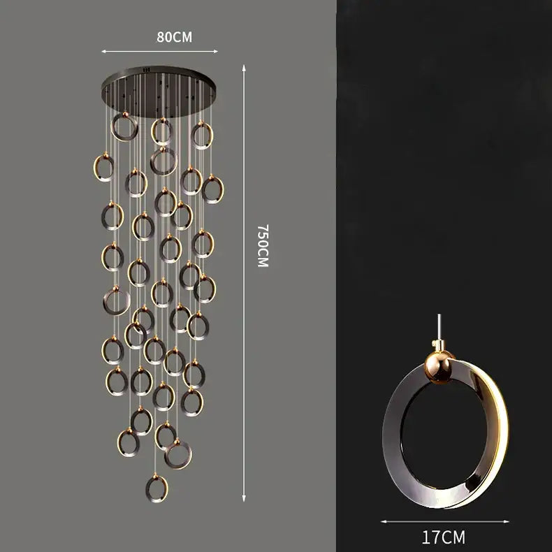 Modern minimalist decorbites crystal chandelier with black ceiling mount and cascading polished gold and matte silver rings