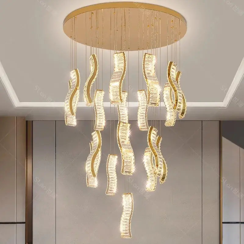 Gold-toned DecorBites crystal chandelier pendant light with cascading curved crystal elements for stair or living room lighting