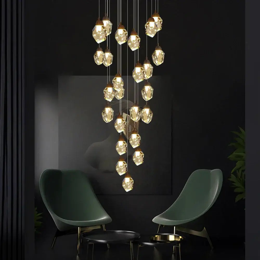 A modern DecorBites crystal chandelier staircase pendant with faceted crystal glass pendants and LED lighting fixture