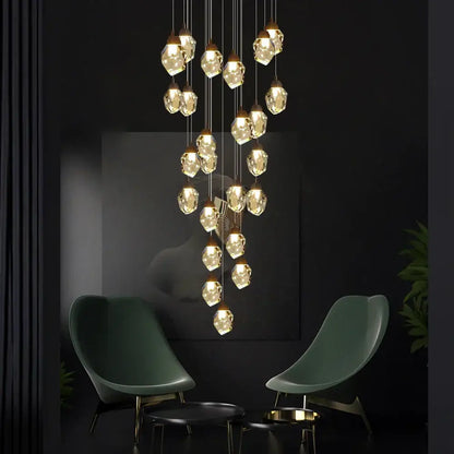 A modern DecorBites crystal chandelier staircase pendant with faceted crystal glass pendants and LED lighting fixture