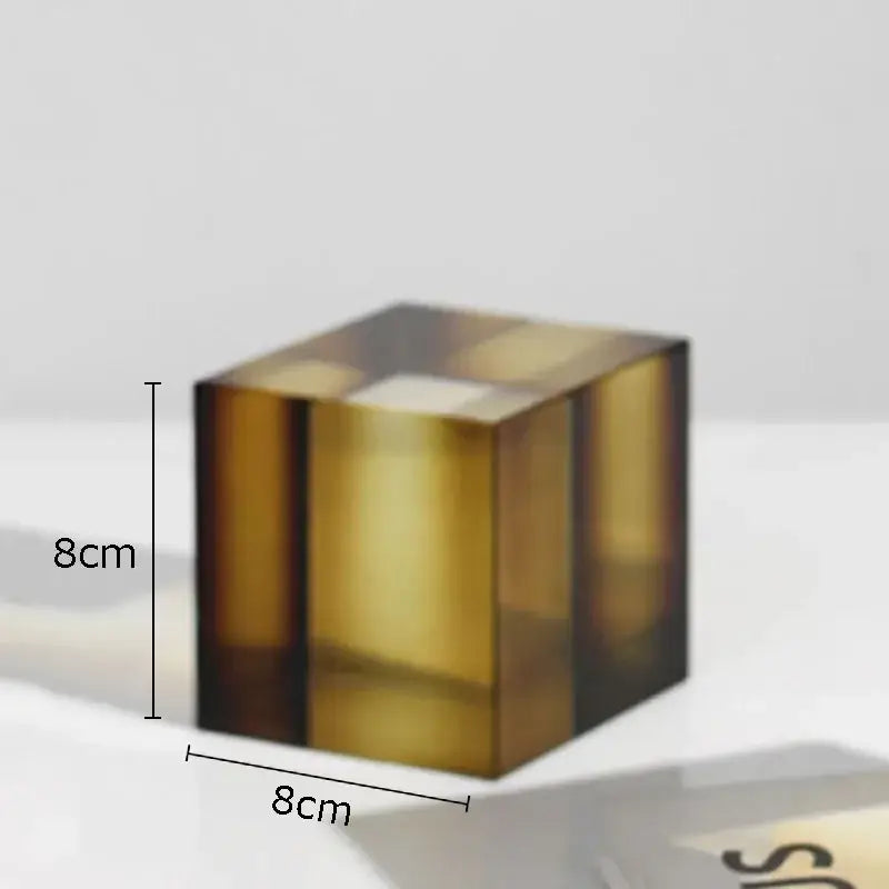 An 8cm amber-colored glass decorbites crystal cube with a translucent gradient finish for living room decor