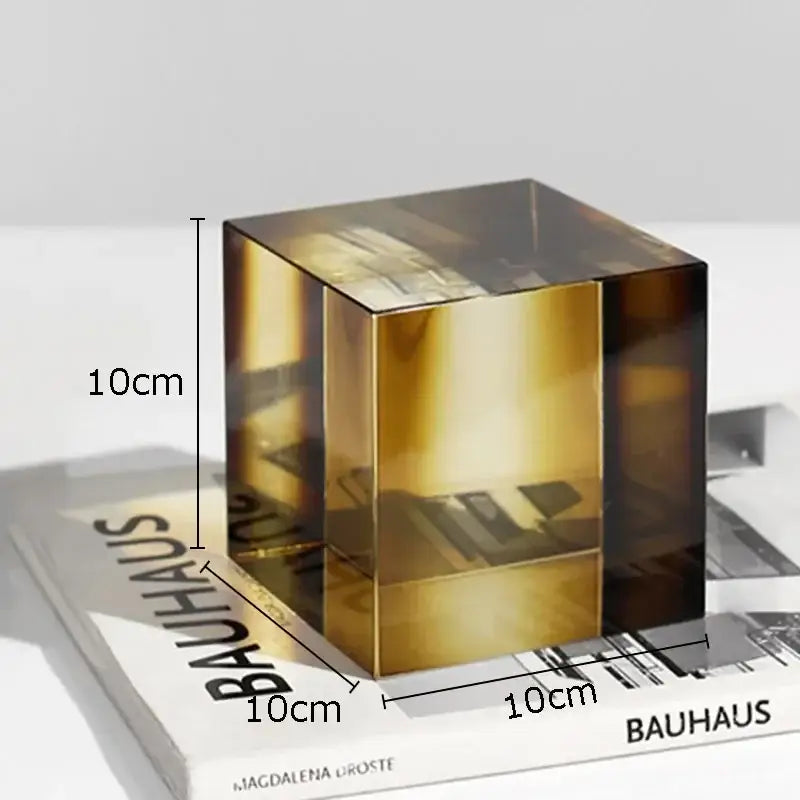 A 10cm decorbites crystal cube with translucent amber hue and reflective surfaces for living room decor