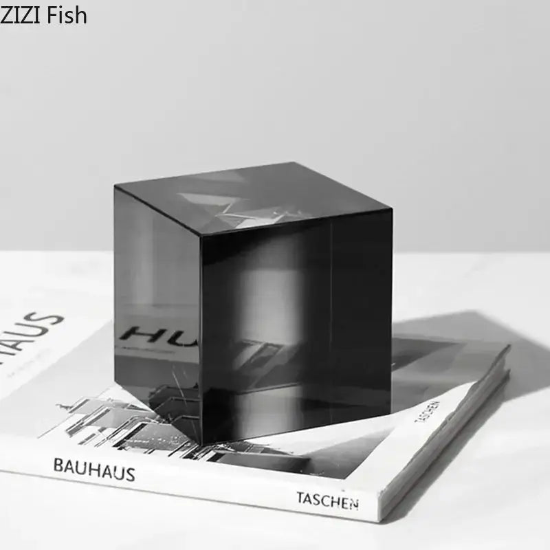 A sleek translucent black glass decorbites crystal cube with polished surface and subtle reflections for living room decor