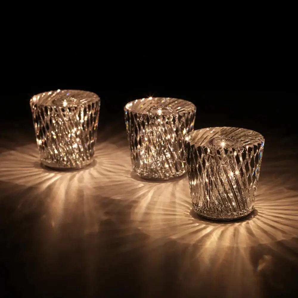 Three elegant clear crystal diamond night light candle holders with intricate faceted patterns from Decorbites