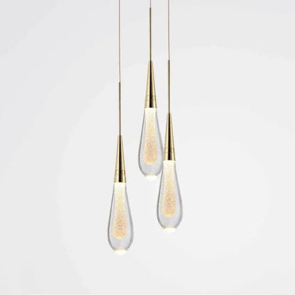 Three elegant decorbites crystal drop chandelier pendant lights with gold metal and clear glass for dining room use
