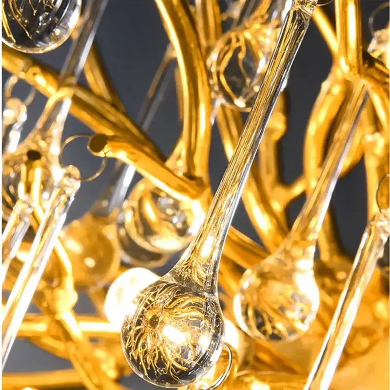 Golden decorbites crystal drop chandelier with intricate etched designs and clear crystal droplets for dining room lighting