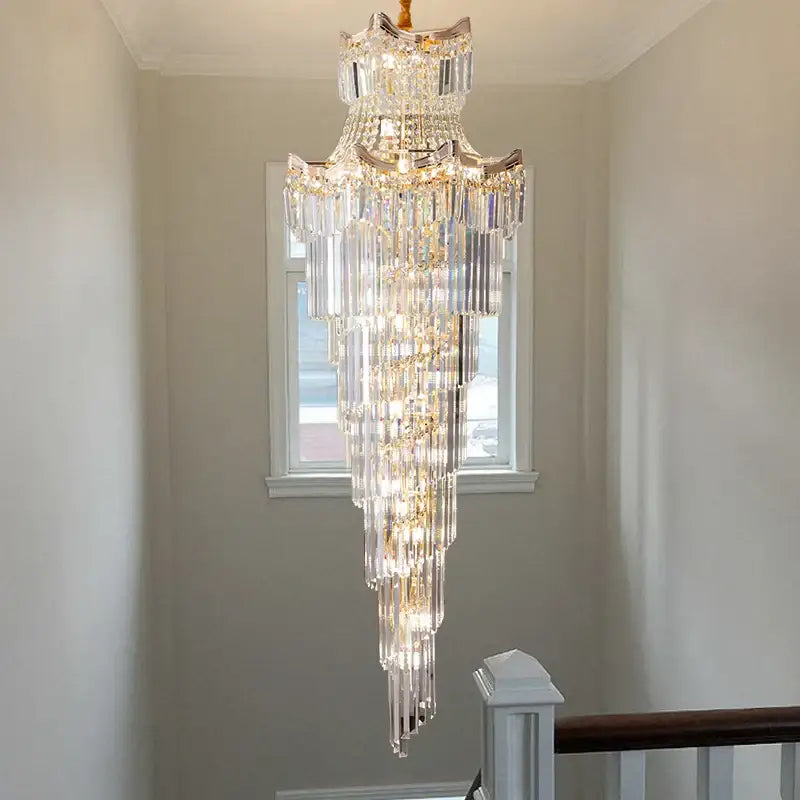 Decorbites crystal duplex chandelier with cascading clear glass prisms and gold metal accents for staircase lighting