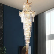 Decorbites crystal duplex chandelier with gold-toned metal and cascading clear glass prisms for staircase lighting