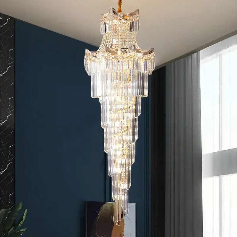 Decorbites crystal duplex chandelier with gold-toned metal and cascading clear glass prisms for staircase lighting