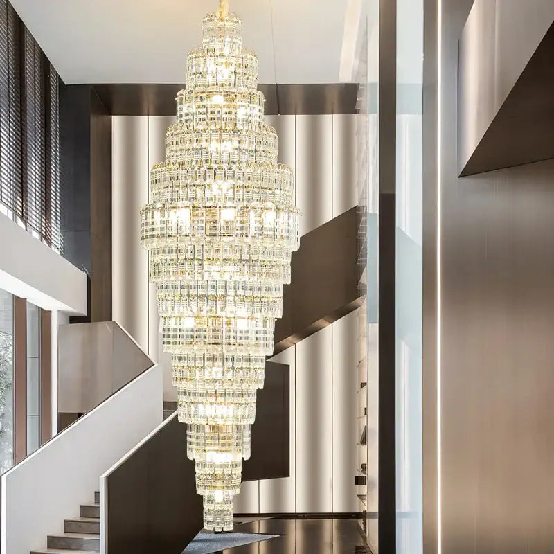 A decorbites crystal duplex chandelier with multi-tiered faceted glass and warm golden lighting for living rooms