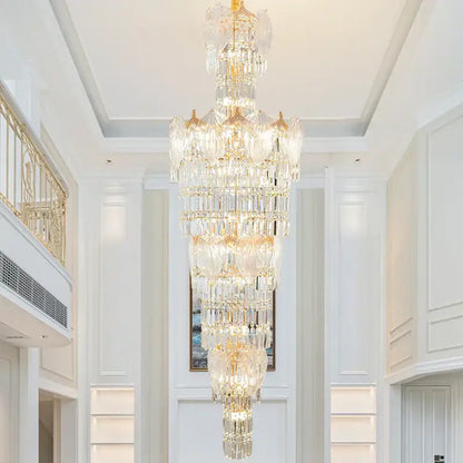 A multi-tiered decorbites crystal european long chandelier with gold-toned accents for living room lighting