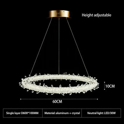 A modern decorbites crystal flower led chandelier with clear crystal rings and gold aluminum ceiling mount for dining rooms