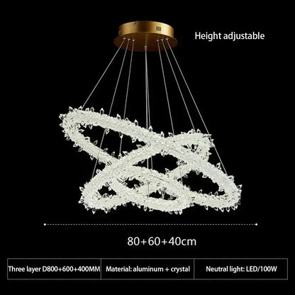 A modern height-adjustable decorbites crystal flower led chandelier with three interlocking crystal rings and gold aluminum base