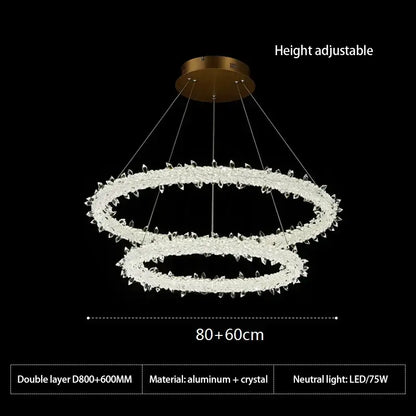 A modern decorbites crystal flower led chandelier with gold mount and double-layer clear faceted crystals for dining room