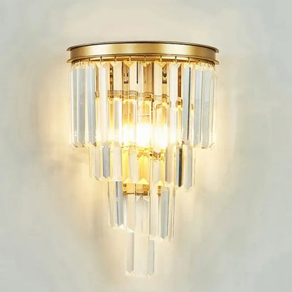 Gold-toned wall sconce with cascading clear crystal prisms in decorbites crystal gold chandelier for living room light