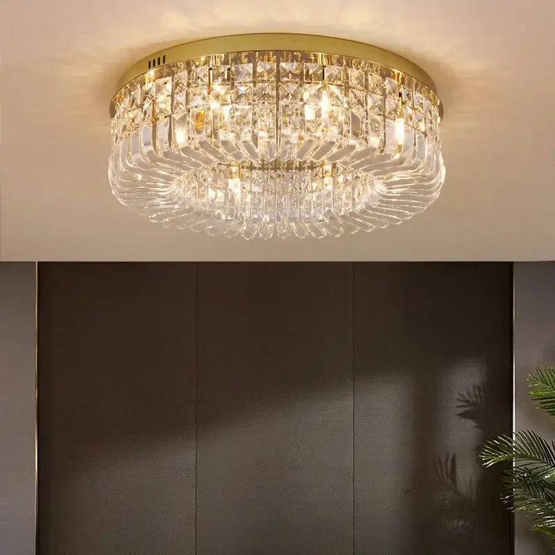 Decorbites crystal gold chandelier ceiling light with gold-toned frame and clear faceted crystal prisms for dining room