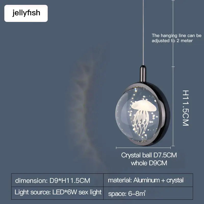 A sleek gold decorbites crystal jellyfish chandelier pendant light with illuminated jellyfish in a transparent crystal ball