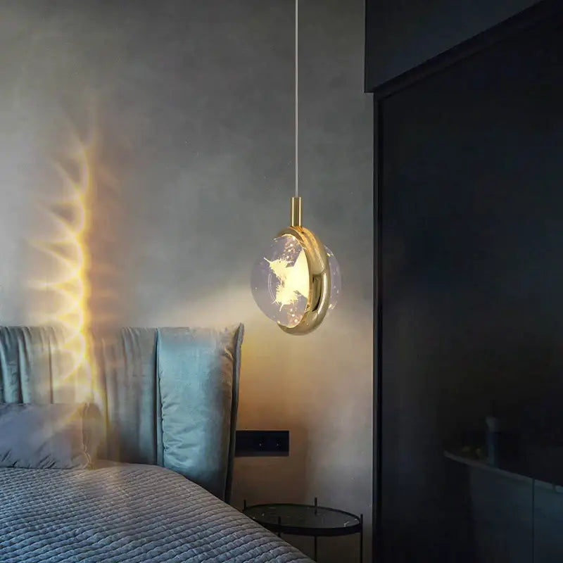 A decorbites crystal jellyfish chandelier gold bedroom pendant light with a gold metal frame and clear glass globe