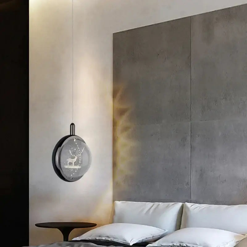A decorbites crystal jellyfish chandelier bedroom pendant light with a black frame and illuminated deer silhouette globe