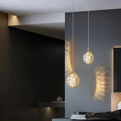 Two elegant gold-toned decorbites crystal jellyfish chandelier pendant lights with circular crystal-encrusted glass shades