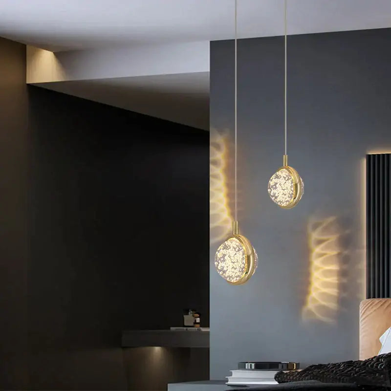 Two elegant gold-toned decorbites crystal jellyfish chandelier pendant lights with circular crystal-encrusted glass shades