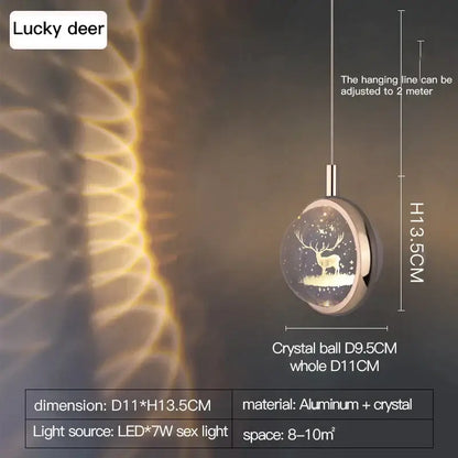 A sleek gold decorbites crystal jellyfish chandelier pendant light with an illuminated deer silhouette against stars