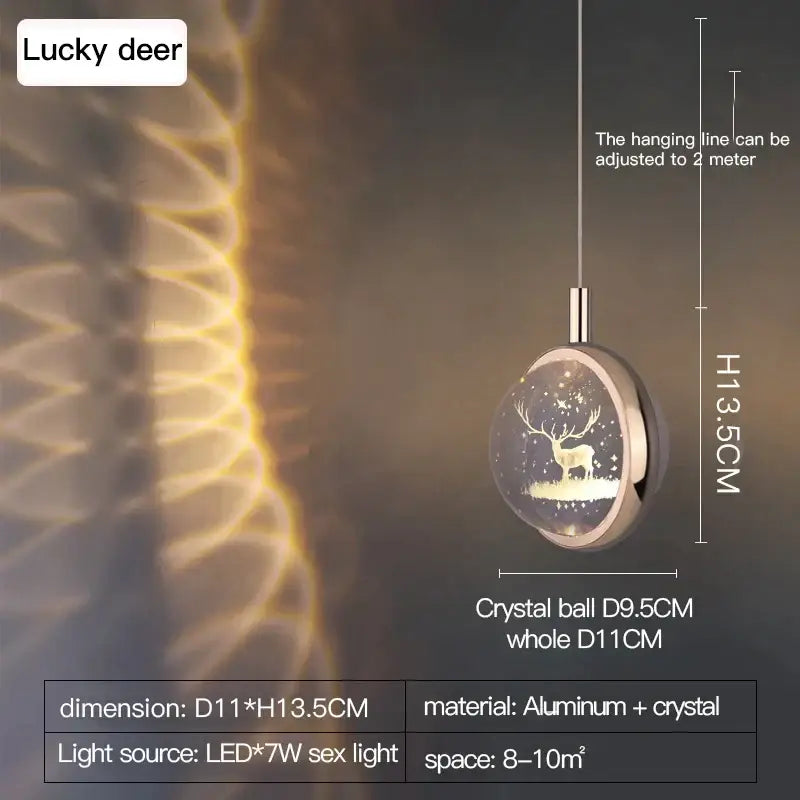 A sleek gold decorbites crystal jellyfish chandelier pendant light with an illuminated deer silhouette against stars
