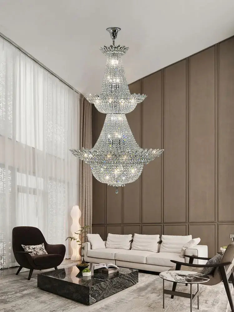 A multi-tiered decorbites crystal led chandelier with polished chrome finish for elegant living room lighting