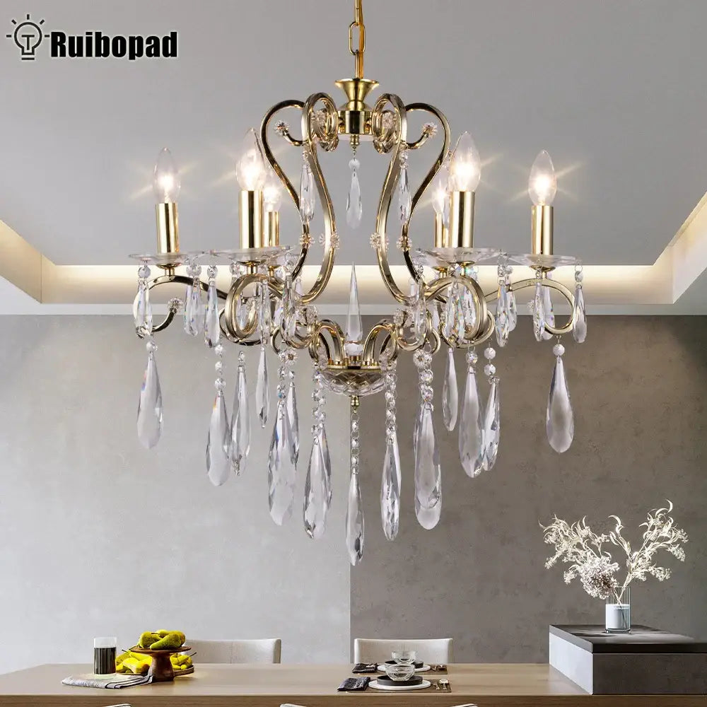 Gold-toned decorbites crystal led chandelier with clear crystal droplets and candle-style bulbs for dining room pendant light