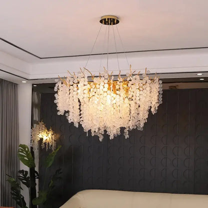 A modern decorbites crystal led chandelier with gold-toned frame and cascading clear crystal discs for dining room