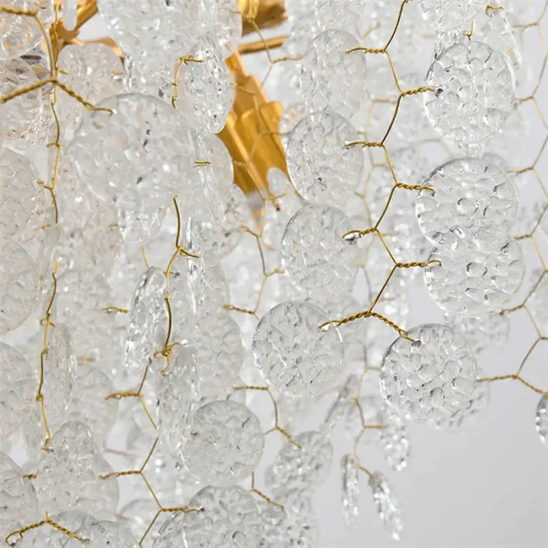 Clear textured glass grape-like pendants on gold-toned wire frame in decorbites crystal led chandelier for dining room